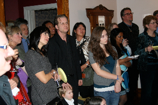 Salon guests watching the dramatic readings. The playwright is at center.
